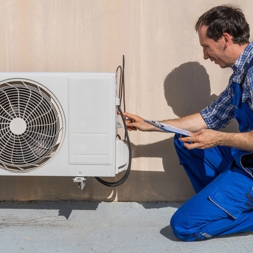 An HVAC Technician Checks a Mini Split AC.