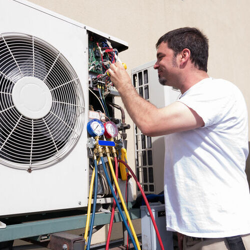 A Service Technician Works on AC Parts Replacement.