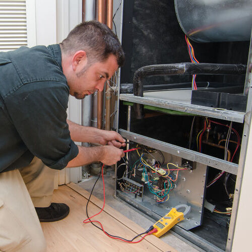 HVAC Technician Provides Heater Maintenance.